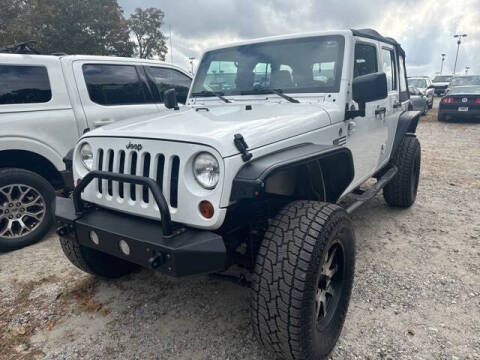 2013 Jeep Wrangler Unlimited for sale at BILLY HOWELL FORD LINCOLN in Cumming GA