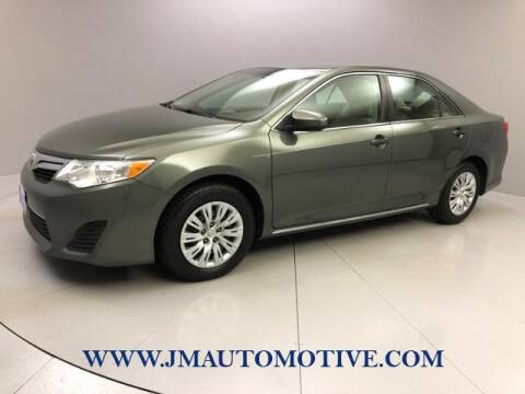 2013 Toyota Camry for sale at J & M Automotive in Naugatuck CT