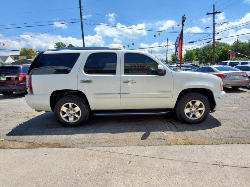 2007 GMC Yukon for sale at DAGO'S AUTO SALES LLC in Dalton, GA