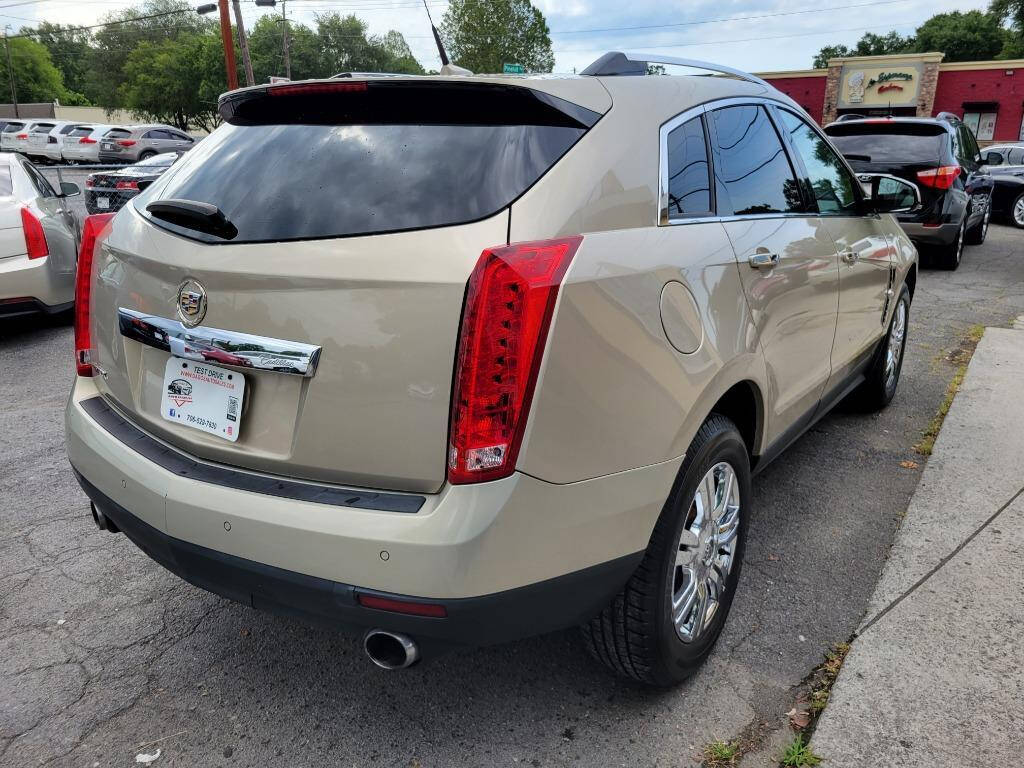 2011 Cadillac SRX for sale at DAGO'S AUTO SALES LLC in Dalton, GA