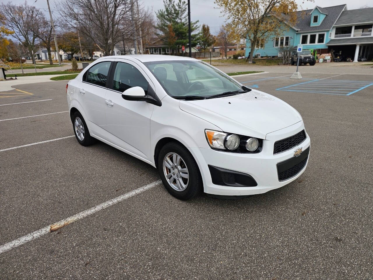 2014 Chevrolet Sonic for sale at WAGNER AUTO MART LLC in Ann Arbor, MI