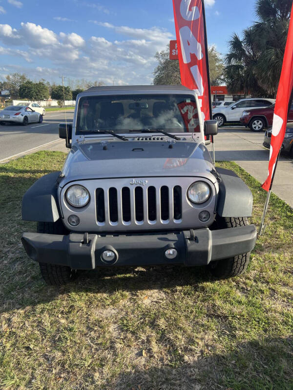 2014 Jeep Wrangler Unlimited for sale at DM Auto Sales in Daytona Beach FL