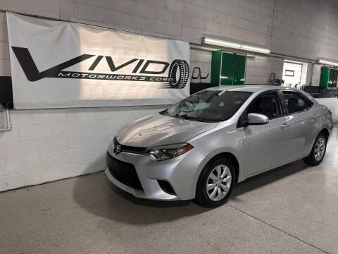 2014 Toyota Corolla for sale at VIVID MOTORWORKS, CORP. in Villa Park IL