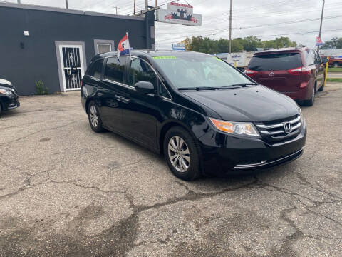 2016 Honda Odyssey for sale at Castle Cars Inc. in Lansing MI