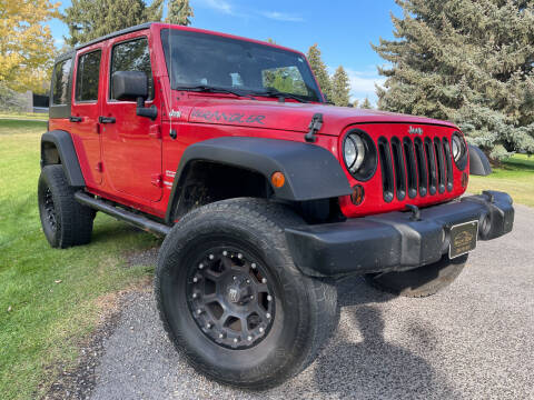 2012 Jeep Wrangler Unlimited for sale at BELOW BOOK AUTO SALES in Idaho Falls ID