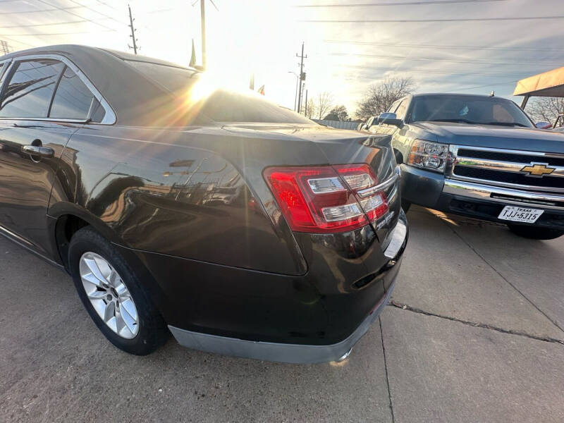 2014 Ford Taurus for sale at Buy-Fast Autos in Houston TX