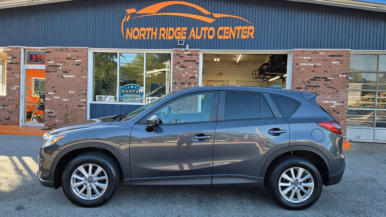 2015 Mazda CX-5 for sale at North Ridge Auto Center LLC in Madison, OH