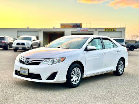 2012 Toyota Camry for sale at BARMAN AUTO INC in Bakersfield CA