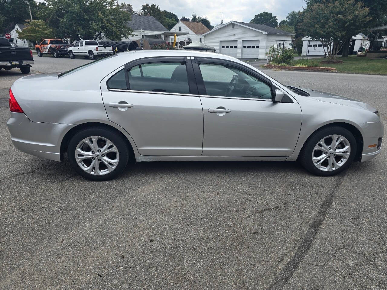 2012 Ford Fusion for sale at QUEENSGATE AUTO SALES in York, PA