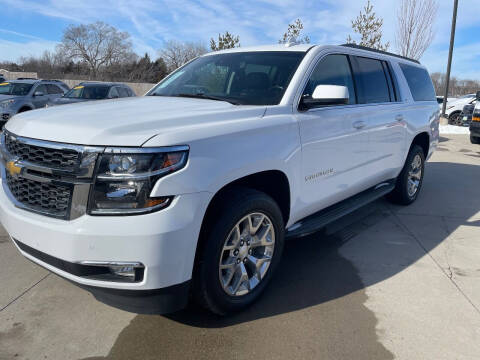 2015 Chevrolet Suburban for sale at Azteca Auto Sales LLC in Des Moines IA