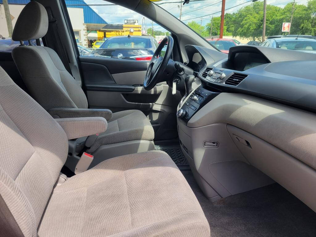 2012 Honda Odyssey for sale at DAGO'S AUTO SALES LLC in Dalton, GA