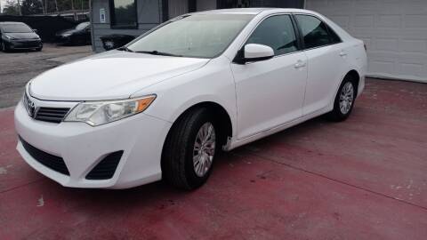 2014 Toyota Camry for sale at ROYAL AUTO MART in Tampa FL