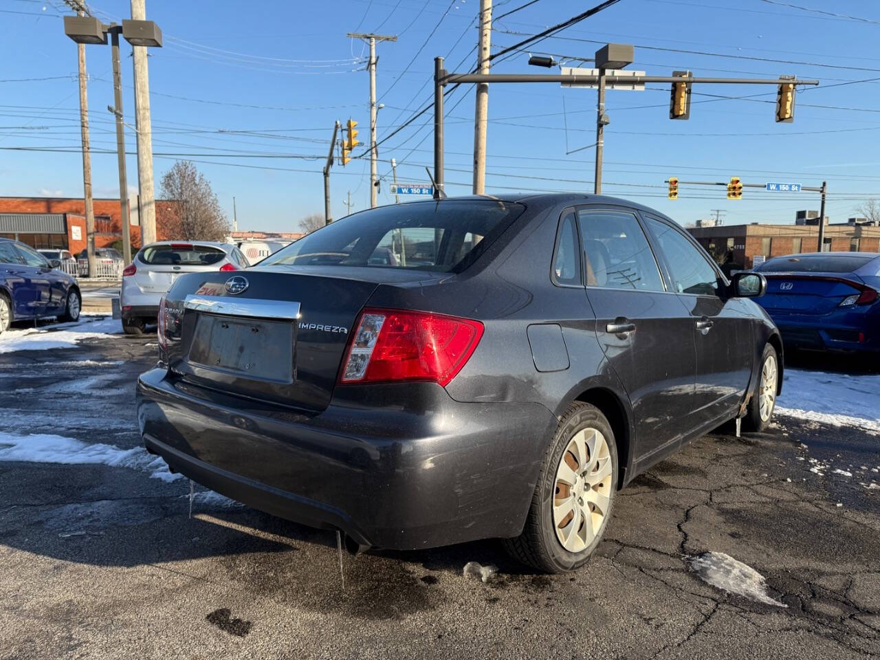 2009 Subaru Impreza for sale at AVS AUTO GROUP LLC in CLEVELAND, OH