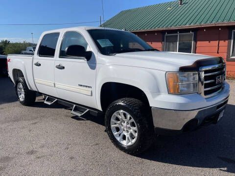 2013 GMC Sierra 1500 for sale at BERKENKOTTER MOTORS in Brighton CO