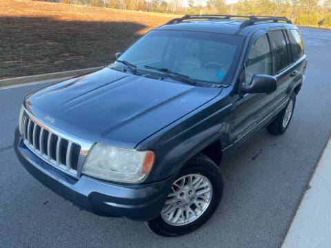 2004 Jeep Grand Cherokee for sale at Cheko SW Auto Sales LLC in Suwanee GA