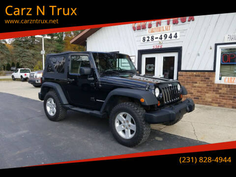 2009 Jeep Wrangler for sale at Carz N Trux in Twin Lake MI