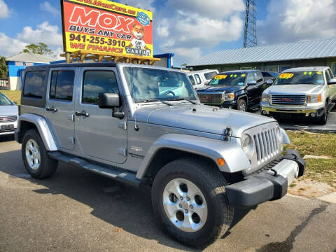 2014 Jeep Wrangler Unlimited for sale at Mox Motors in Port Charlotte FL