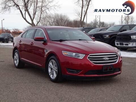2016 Ford Taurus for sale at RAVMOTORS in Burnsville MN