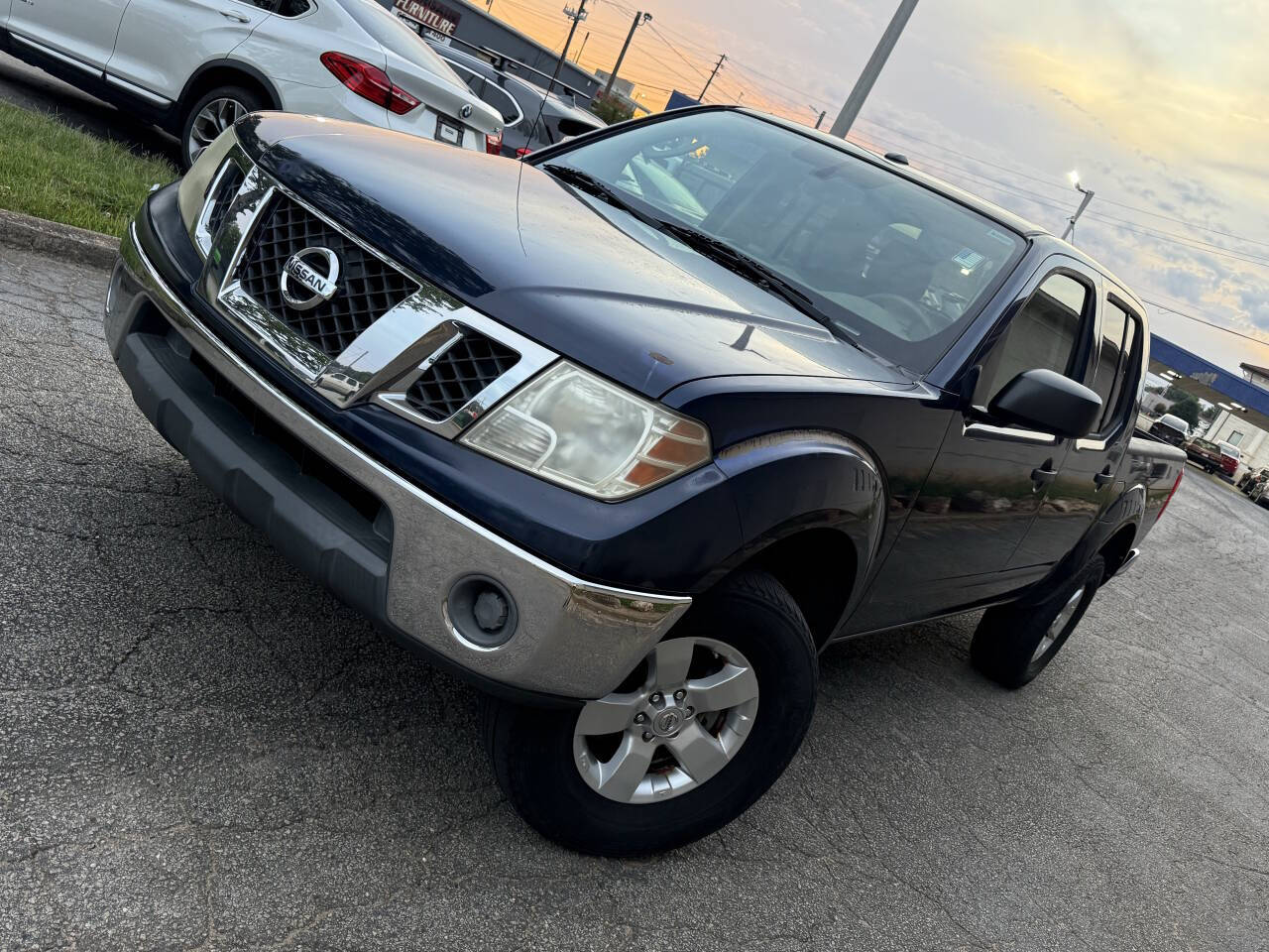 Blue 2011 Nissan Frontier Pickup Truck Four-Wheel Drive 5-Speed Automatic