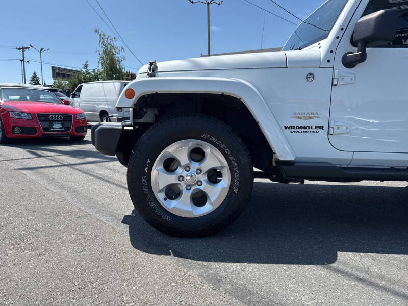 Used 2014 Jeep Wrangler Unlimited Sahara with VIN 1C4HJWEG1EL203381 for sale in Edmonds, WA