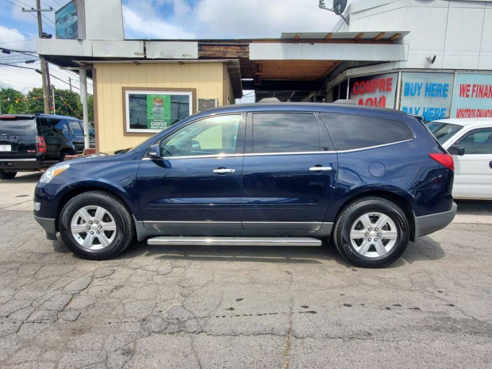 2012 Chevrolet Traverse for sale at DAGO'S AUTO SALES LLC in Dalton, GA