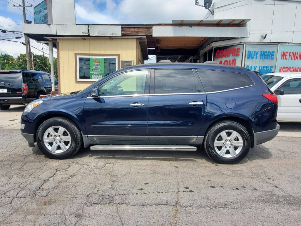 2012 Chevrolet Traverse for sale at DAGO'S AUTO SALES LLC in Dalton, GA