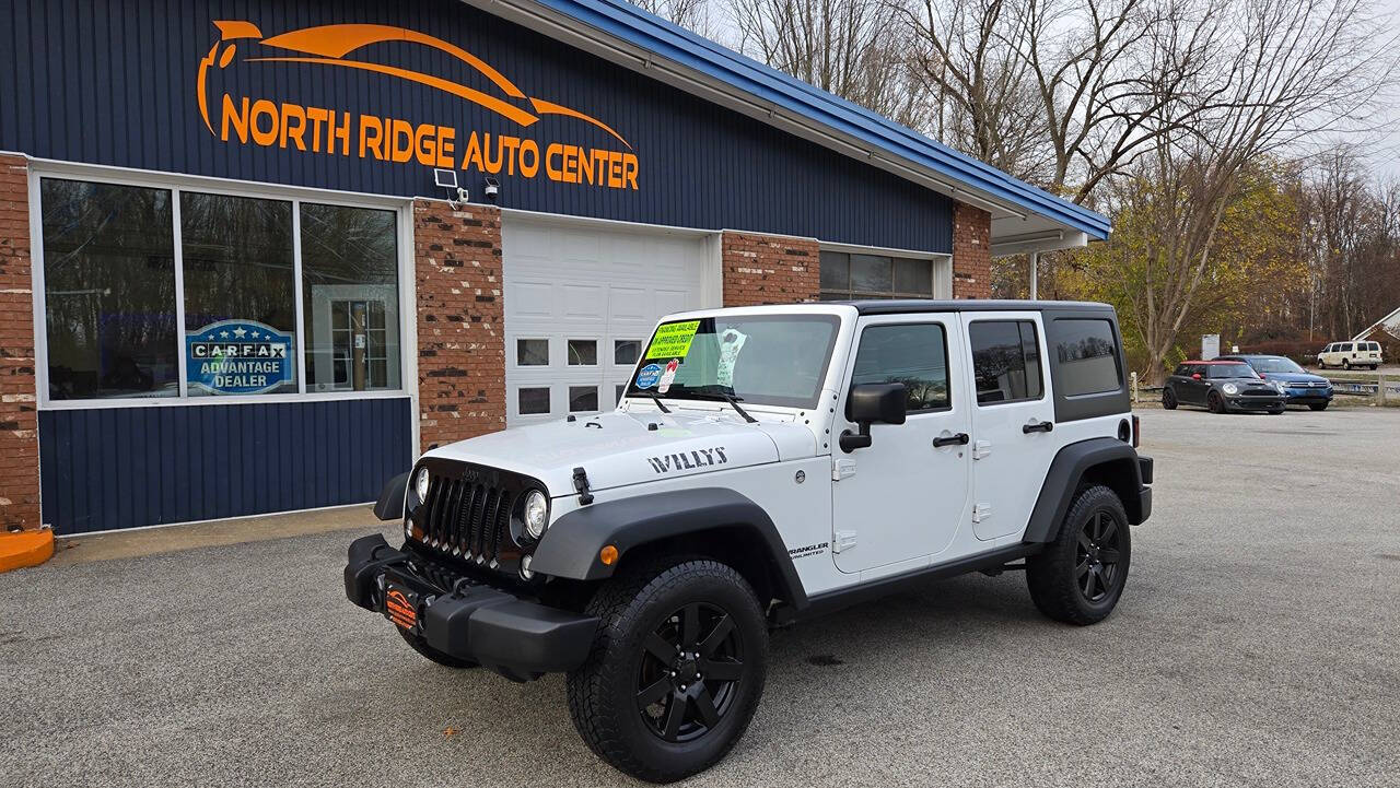 2017 Jeep Wrangler Unlimited for sale at North Ridge Auto Center LLC in Madison, OH