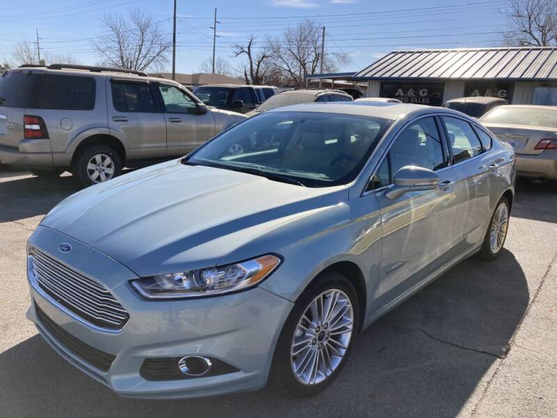 2014 Ford Fusion Hybrid for sale at A & G Auto Sales in Lawton OK