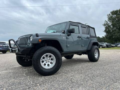 2014 Jeep Wrangler Unlimited for sale at CarWorx LLC in Dunn NC
