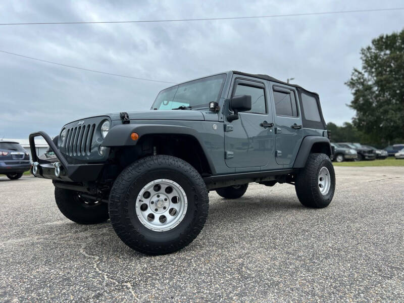 2014 Jeep Wrangler Unlimited for sale at Carworx LLC in Dunn NC