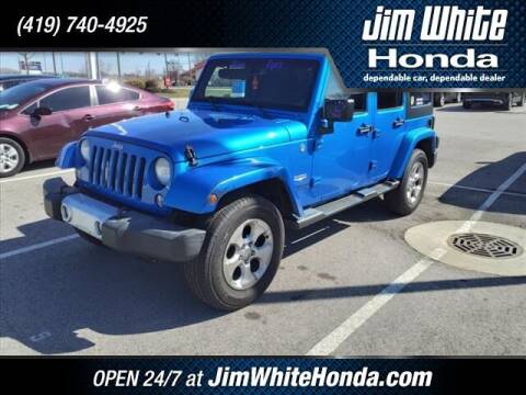 2014 Jeep Wrangler Unlimited for sale at The Credit Miracle Network Team at Jim White Honda in Maumee OH