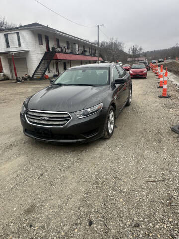 2016 Ford Taurus for sale at LEE'S USED CARS INC ASHLAND in Ashland KY