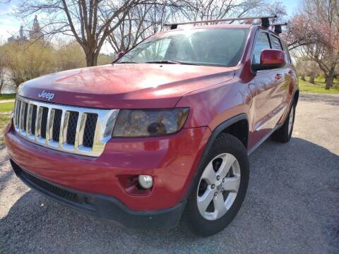 2011 Jeep Grand Cherokee for sale at BELOW BOOK AUTO SALES in Idaho Falls ID
