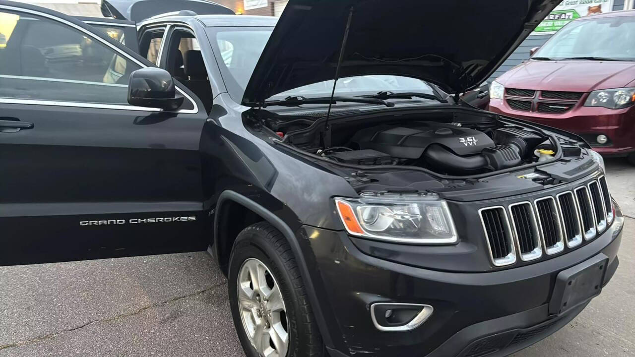 2014 Jeep Grand Cherokee for sale at Ganda Auto Sales in Denver, CO