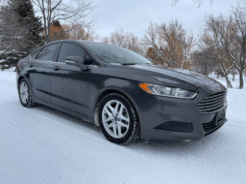 2015 Ford Fusion for sale at BELOW BOOK AUTO SALES in Idaho Falls ID