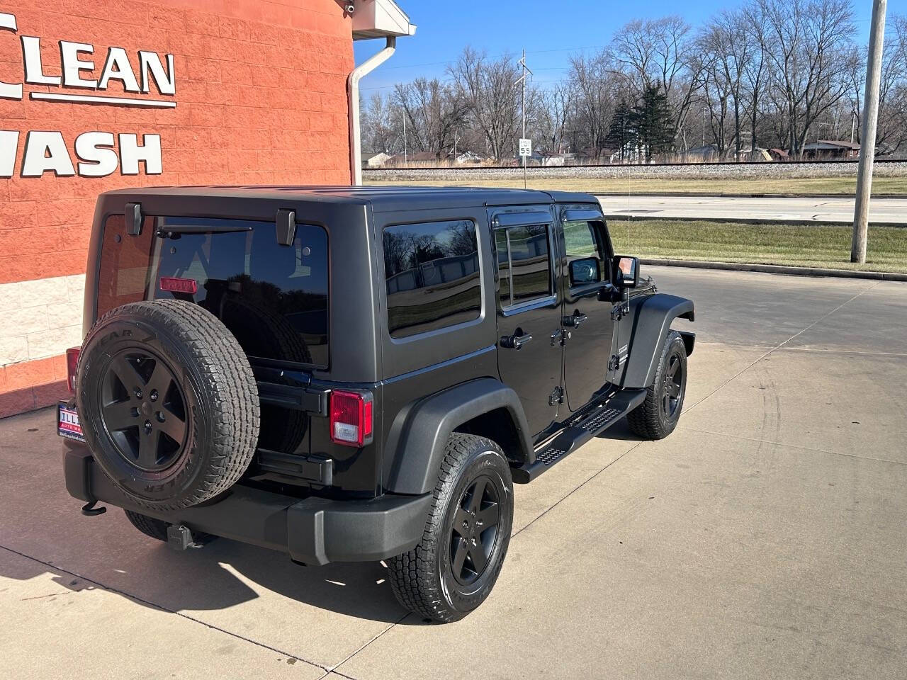 2014 Jeep Wrangler Unlimited for sale at Illinois Auto Wholesalers in Tolono, IL