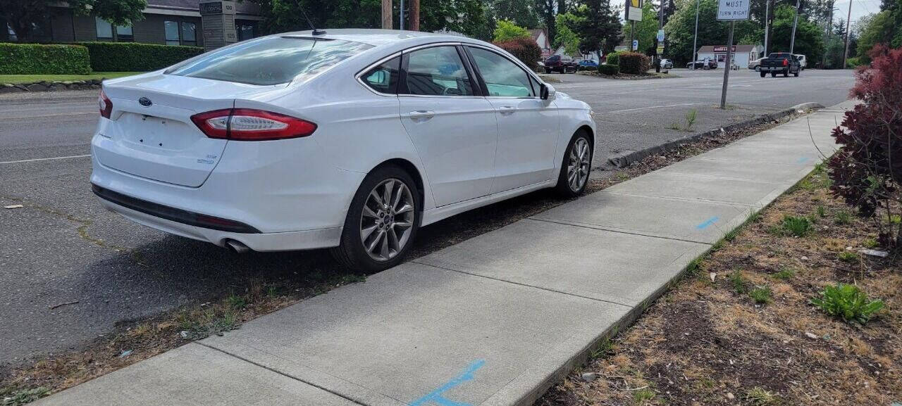 2015 Ford Fusion for sale at BENCHMARK AUTO SALES in Parkland, WA