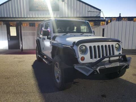 2013 Jeep Wrangler Unlimited for sale at BELOW BOOK AUTO SALES in Idaho Falls ID