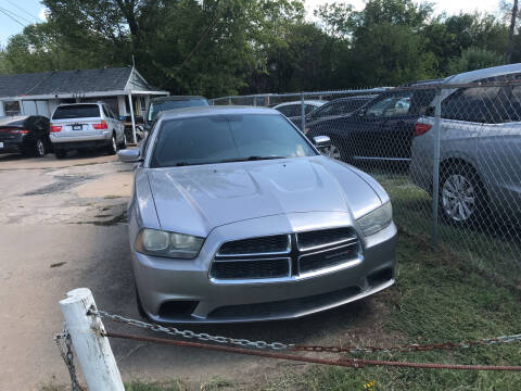 2013 Dodge Charger for sale at Simmons Auto Sales in Denison TX