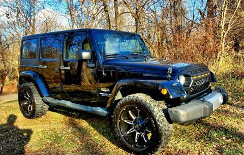 2014 Jeep Wrangler Unlimited for sale at GOLDEN RULE AUTO in Newark OH