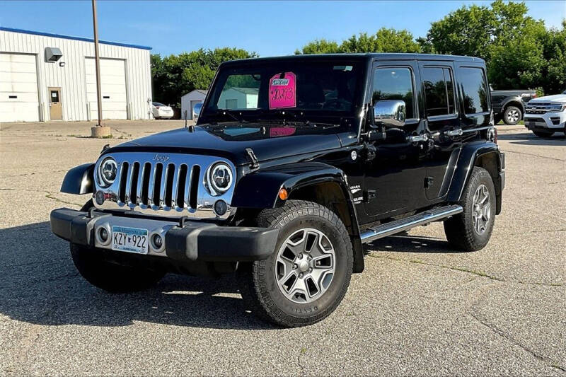 Used 2014 Jeep Wrangler Unlimited Sahara with VIN 1C4BJWEG5EL141411 for sale in Montevideo, Minnesota