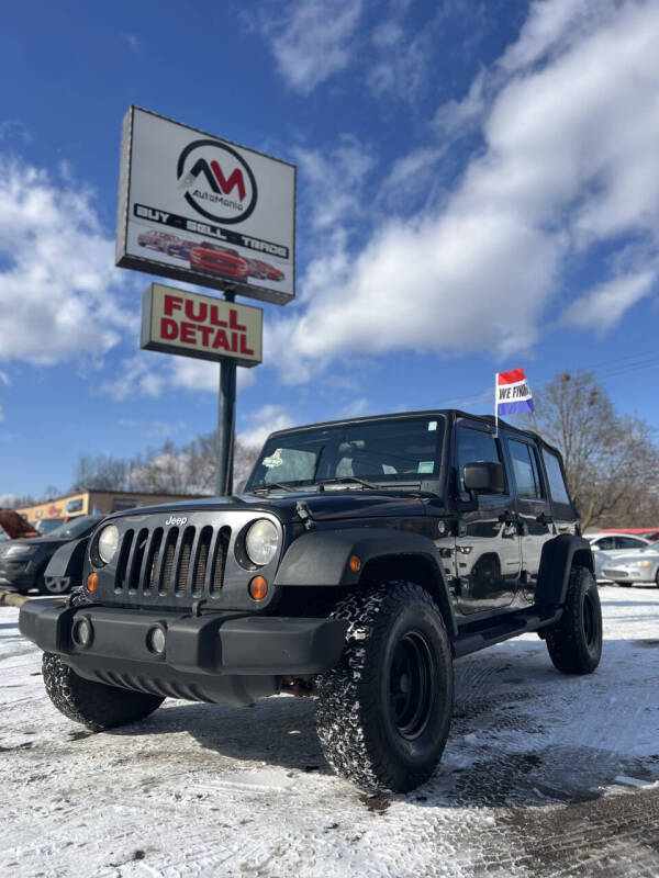 2010 Jeep Wrangler Unlimited for sale at Automania in Dearborn Heights MI