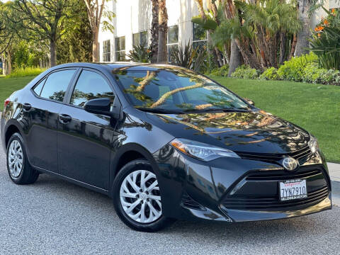 2018 Toyota Corolla for sale at MILLENNIUM MOTORS in Van Nuys CA