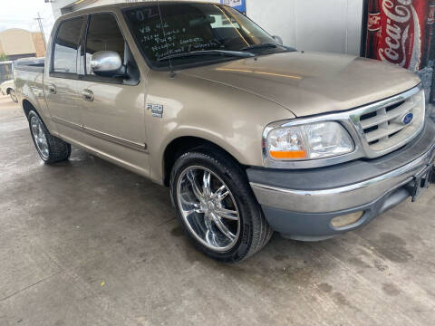 2002 Ford F-150 for sale at Buy-Fast Autos in Houston TX