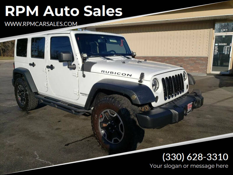 2014 Jeep Wrangler Unlimited for sale at RPM Auto Sales in Mogadore OH