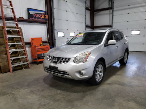 2011 Nissan Rogue for sale at Hometown Automotive Service & Sales in Holliston MA