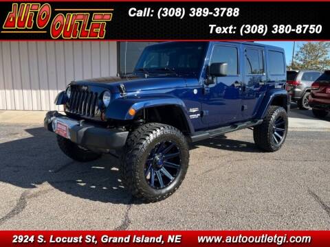 2013 Jeep Wrangler Unlimited for sale at Auto Outlet in Grand Island NE