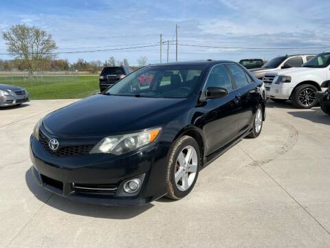 2012 Toyota Camry for sale at The Auto Depot in Mount Morris MI