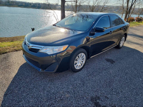 2012 Toyota Camry for sale at PUTNAM AUTO SALES INC in Marietta OH