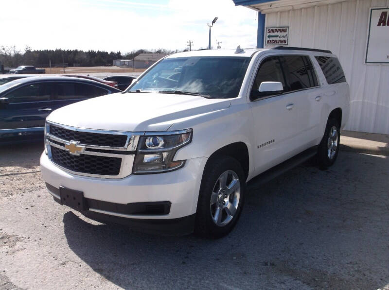 2015 Chevrolet Suburban for sale at AUTO TOPIC in Gainesville TX